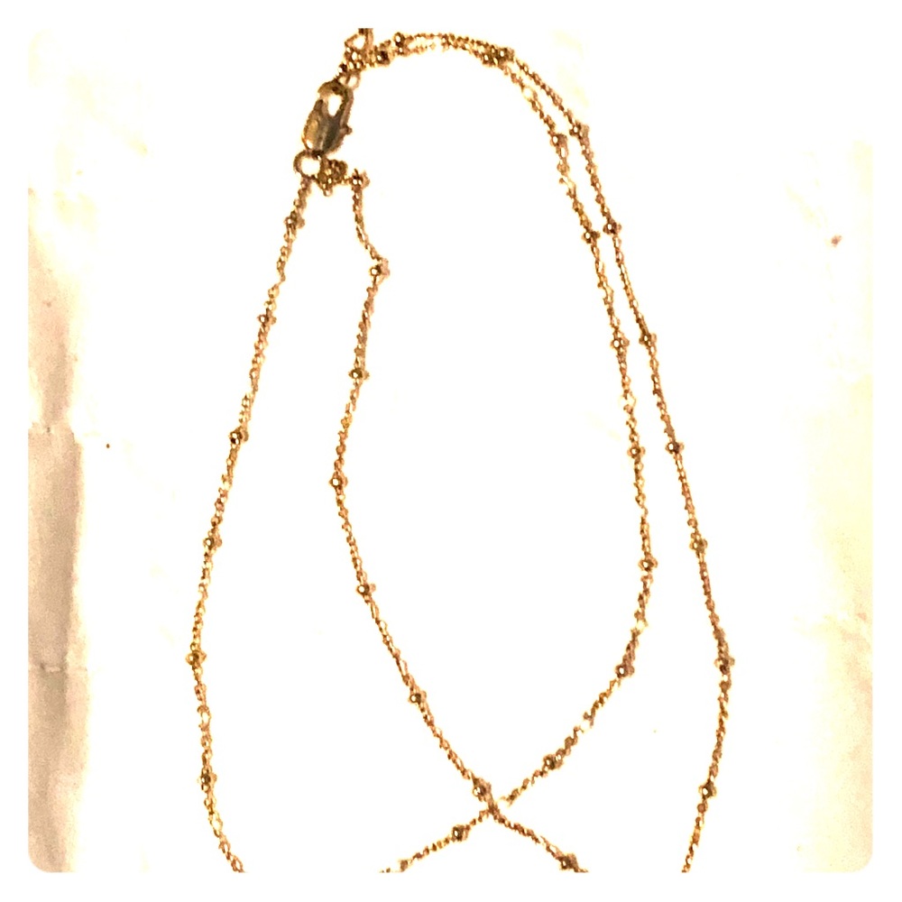 A delicate double stranded Tai bracelet